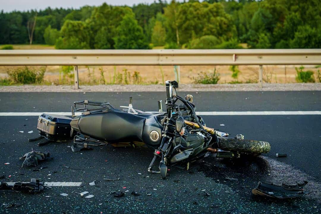 Motorcycle crashed on the side of a highway